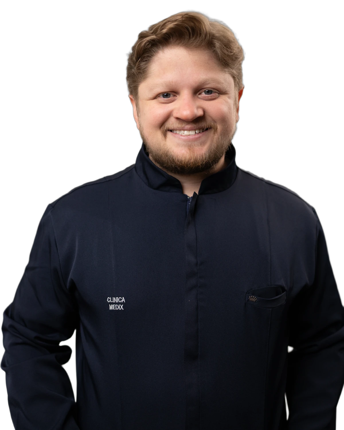 Dr. Yuri Vasques, ginecologista, sorrindo de jaleco azul-marinho